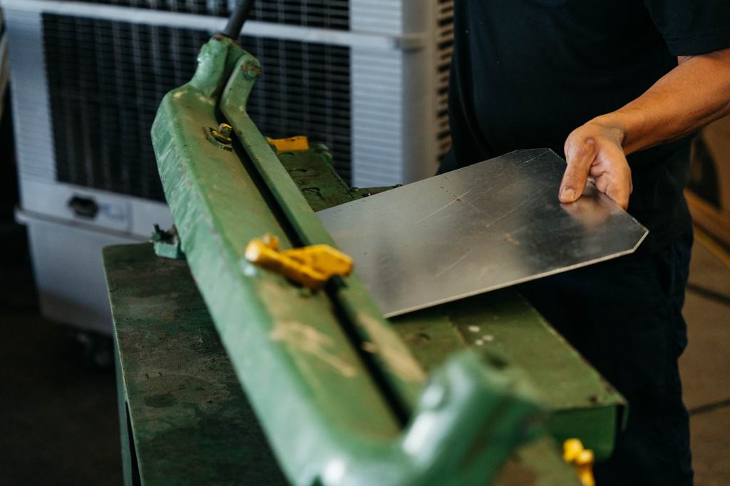Fabricator forming sheet metal on a hand brake