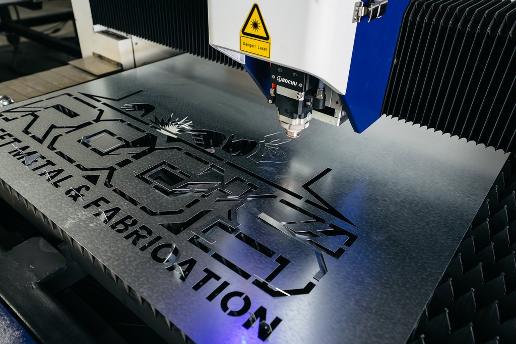 Fiber laser cutting steel sheet with sparks